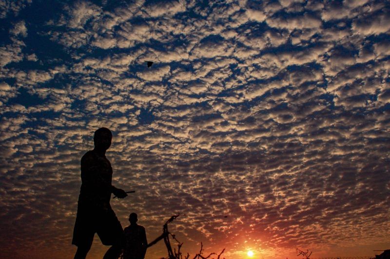 Gurugram: Silhouette of a man during sunrise in Gurugram, Tuesday, Oct. 5, 2021. (PTI Photo)