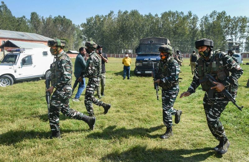 Security personnel arrive at Government Boys Higher Secondary School after militants shot dead two teachers including a female, at Eidgah Sangam area of Srinagar on October 7, 2021. (PTI Photo)