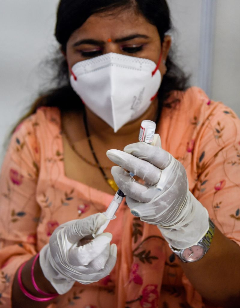 A health worker prepares Covid-19 vaccine dose to administer to a beneficiary at a free vaccination camp organized by the Delhi government, in New Delhi on October 10, 2021. (PTI Photo)