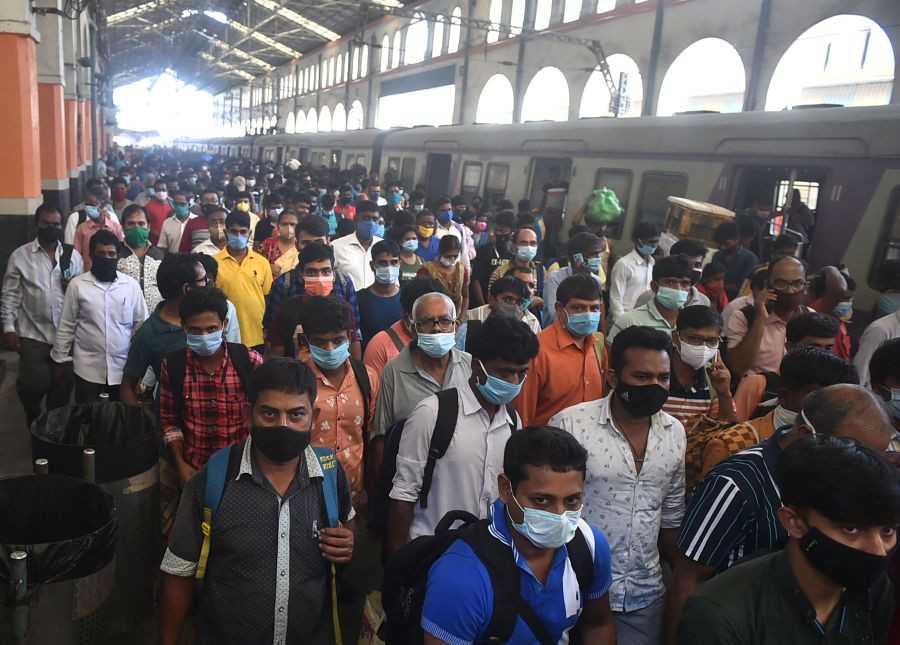 Kolkata: Passengers come out of the platform of Sealdah Railway station after a staff special arrives ahead of resumption of local train services with fifty percent capacity after authority eased some restrictions, in Kolkata, Saturday,Oct 30,2021. (PTI Photo/Swapan Mahapatra)