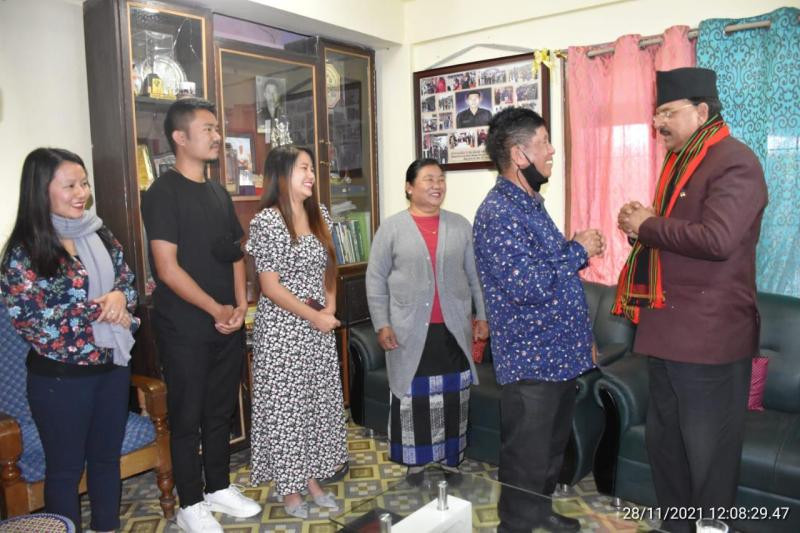 Union Minister of State for Defence and Tourism Ajay Bhatt with the family of Late Capt N Kenguruse, MVC on November 28.