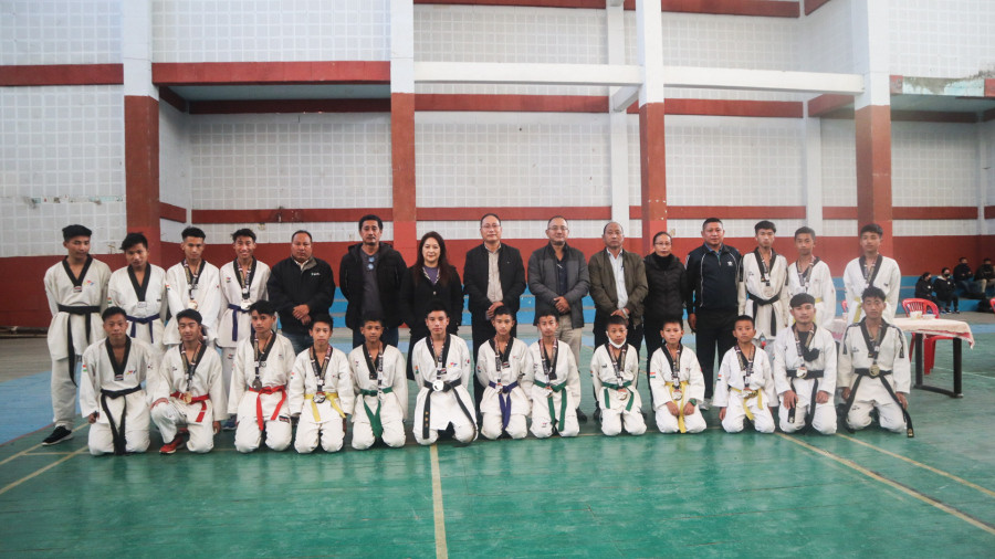 Department of Youth Resources and Sports officials along with medalist at IG Stadium on Friday.