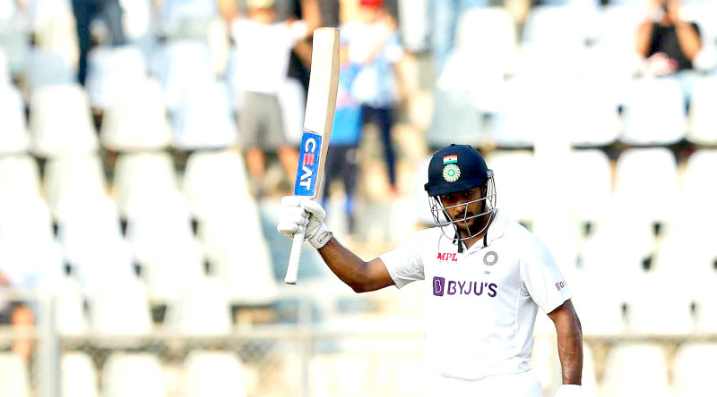 Mayank Agarwal raises his bat after scoring a hundred in Mumbai on Friday. (Twitter: @BCCI)