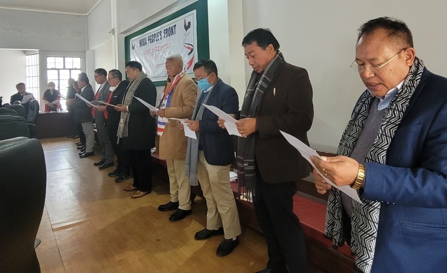 Dr Shürhozelie Liezietsü administers pledge to 10 candidates during the NPF party ticket distribution ceremony in Kohima on February 2. (Morung Photo)
