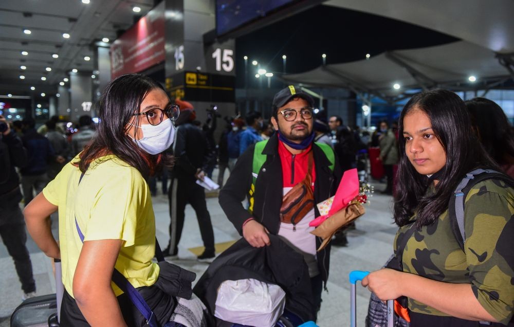 Ukraine, upon their arrival at the IGI Airport, in New Delhi, early Sunday, Feb 27, 2022. Air India’s second evacuation flight from Romanian capital Bucharest carrying 250 Indian nationals who were stranded in Ukraine landed at the airport in the early hours of February 27. (PTI Photo/Kamal Kishore)