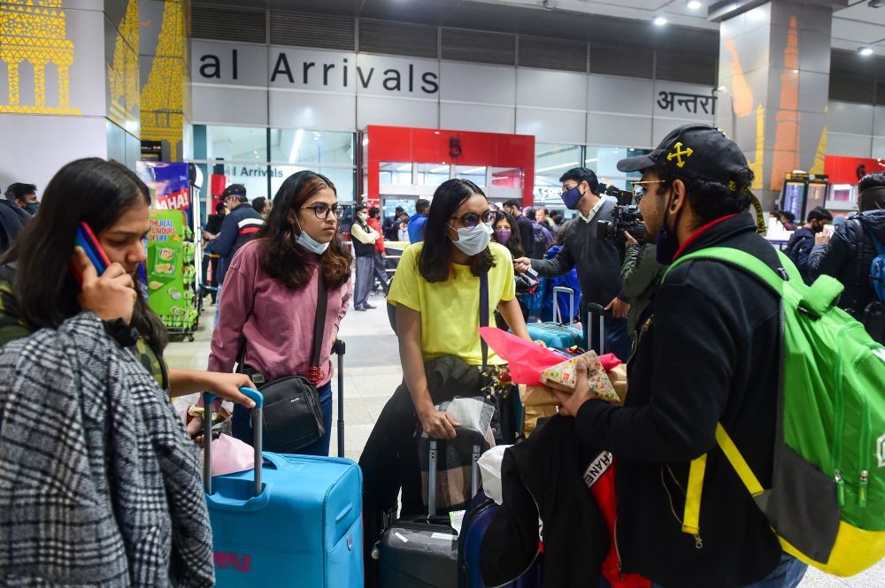 New Delhi: Indian nationals, evacuated from war-torn Ukraine, upon their arrival at the IGI Airport in New Delhi, early Sunday, Feb 27, 2022. Air India’s second evacuation flight from Romanian capital Bucharest carrying 250 Indian nationals who were stranded in Ukraine landed at the airport in the early hours of February 27. (PTI Photo/Kamal Kishore)