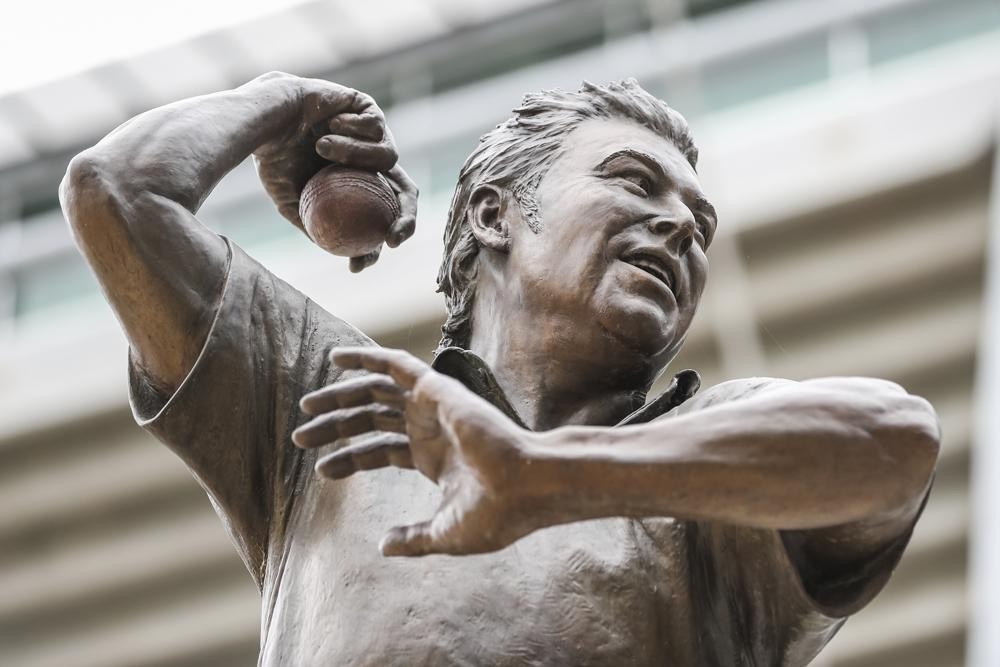 The statue of cricket legend Shane Warne stands outside the Melbourne Cricket Ground in Melbourne, Australia, Saturday, March 5, 2022. Warne, widely regarded as one of the greatest players, most astute tacticians and ultimate competitors in the long history of cricket, has died of a suspected heart attack Friday, March 4, 2022, in Koh Samui, Thailand. He was 52. (AP Photo/Asanka Brendon Ratnayake)