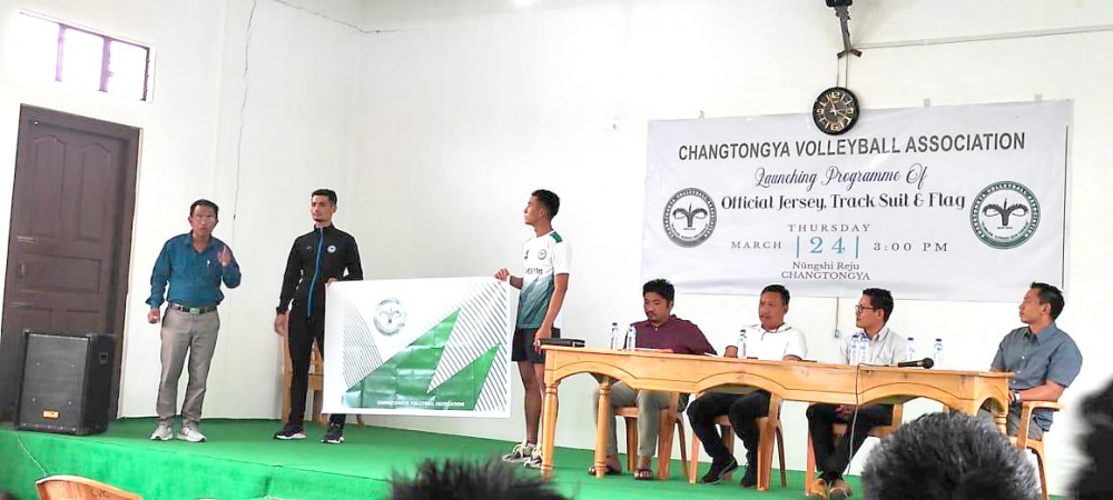 Rev I Wati Jamir, Pastor Changtongya Baptist Church launches the official jersey, track suit and flag of Changtongya Volleyball Association on March 24. (Photo Courtesy: CVA)