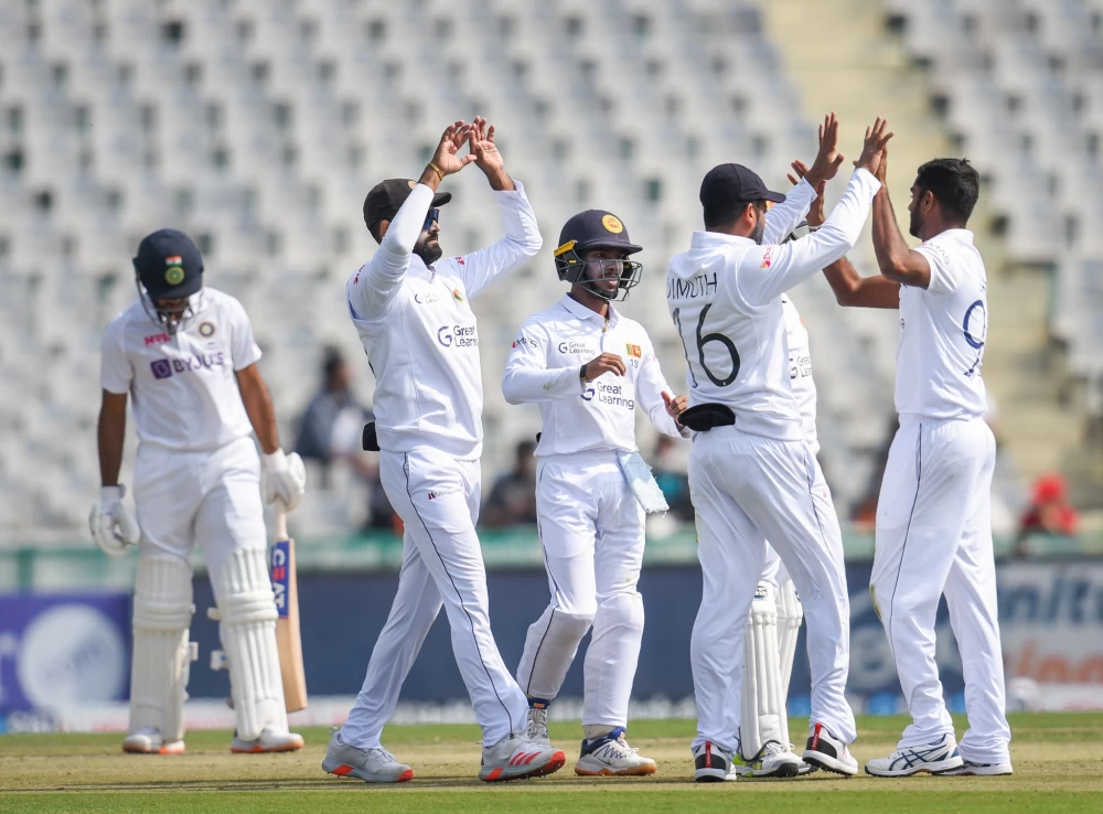 Sri Lanka players celebrate the wicket of Mayank Agarwal on Friday | Photo: PTI