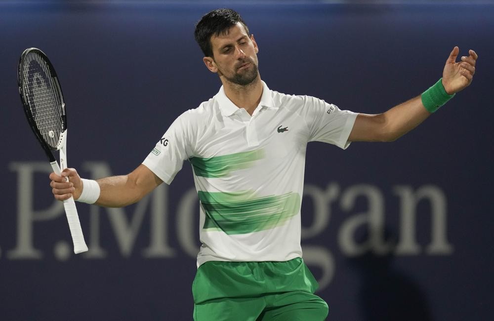 Serbia's Novak Djokovic reacts after he lost a point against Czech Republic's Jiri Vesely during a quarterfinal match of the Dubai Duty Free Tennis Championship in Dubai, United Arab Emirates, Thursday, Feb. 24, 2022. (AP Photo/Kamran Jebreili)