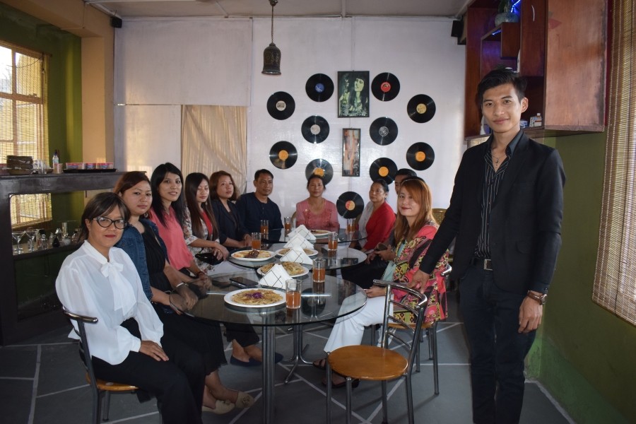 Jungshi Walling (standing extreme right) with family and friends after the launch of his Café Resto Block2takeout at Sangtemla Ward, Mokokchung on March 19. (Morung Photo)