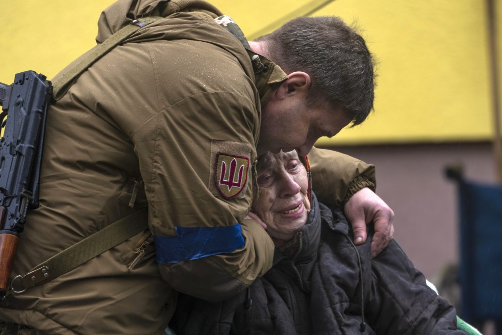 Kyiv: A soldier comforts Larysa Kolesnyk, 82, after she was evacuated from Irpin, on the outskirts of Kyiv, Ukraine, Wednesday, March 30, 2022. (AP/PTI Photo)