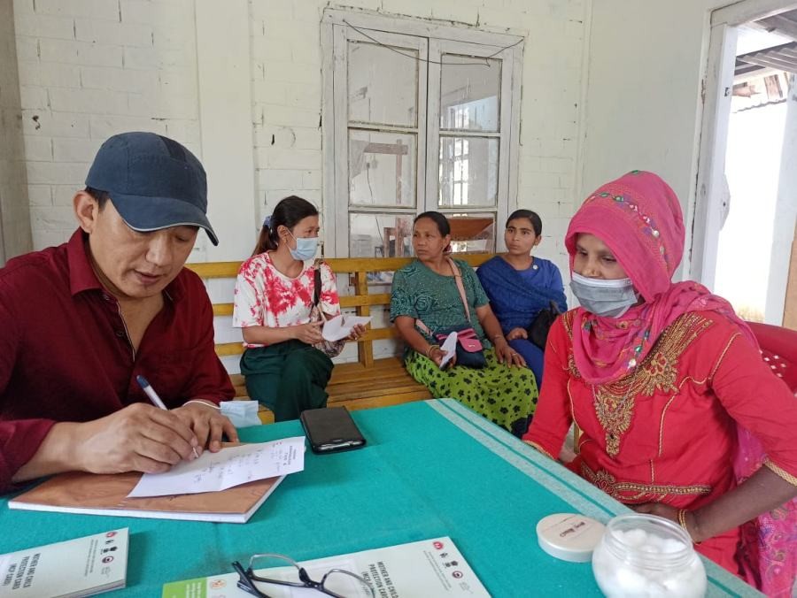 Dr Imtiakum Aier, SMO, Jalukie CHC diagnosing a patient during the health mela.