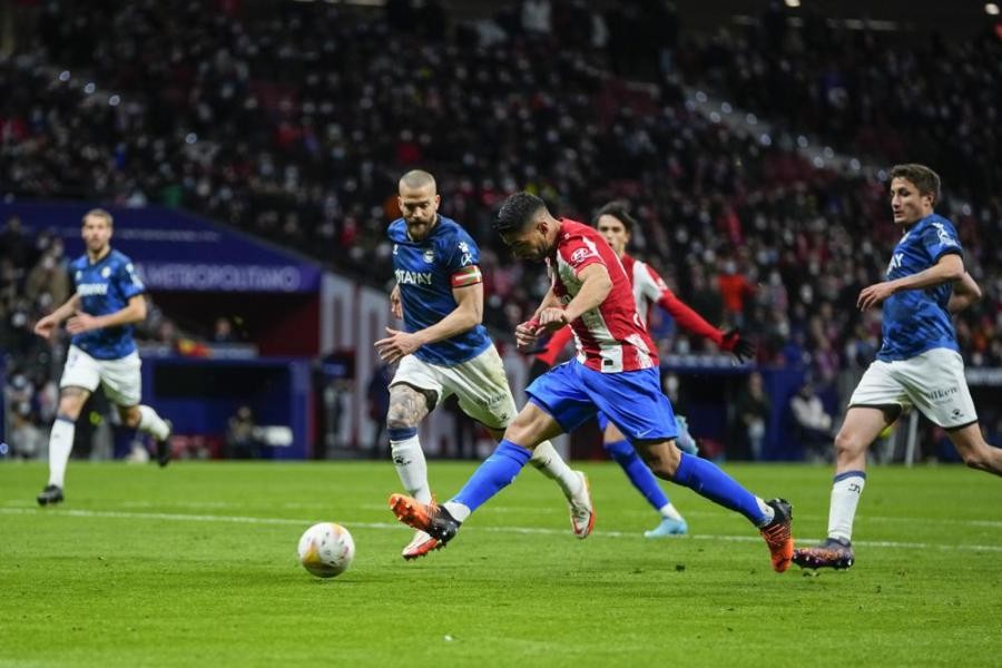 Atletico Madrid's Luis Suarez, center right, scores his side's fourth goal during a Spanish La Liga soccer match between Atletico Madrid and Alaves at the Wanda Metropolitano stadium in Madrid, Spain on April 2. (AP Photo/Manu Fernandez)