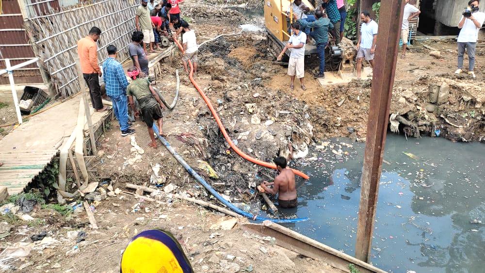 Dimapur Municipal Council clear the clogged drain.