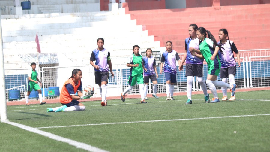 Players of TM Higher Secondary School (green jersey) and Loyola School seen in action during the girl's semifinal match of the Inter High School Tournament at IG stadium Kohima on April 8.