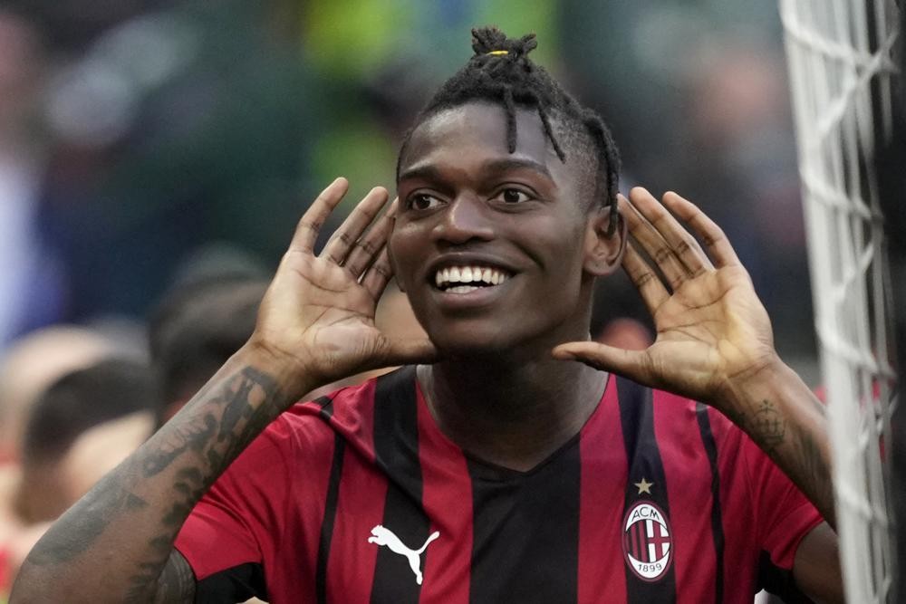 AC Milan's Rafael Leao celebrates after scoring the opening goal during the Serie A soccer match between AC Milan and Atalanta at the San Siro stadium, in Milan, Italy, Sunday, May 15, 2022. (AP Photo/Antonio Calanni)