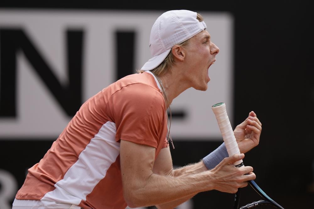 Denis Shapovalov reacts after winning a point to Lorenzo Sonego during their match at the Italian Open tennis tournament, in Rome, Monday, May 9, 2022. (AP Photo/Andrew Medichini)