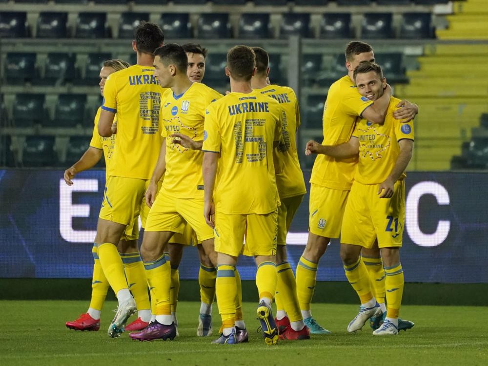 Ukraine players celebrate a goal by Aleksandr Karavaiev during a friendly soccer match against Empoli, Tuesday, May 17, 2022, in Empoli, Italy. (Marco Bucco/LaPresse via AP)