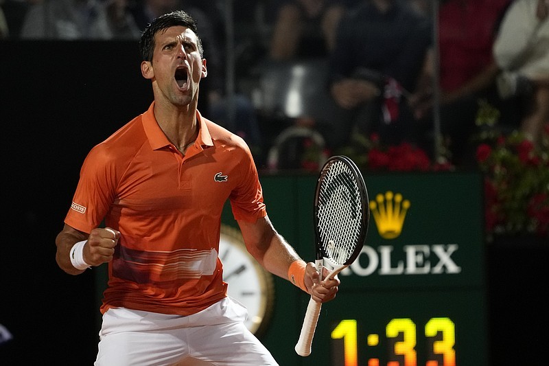 Serbia's Novak Djokovic celebrates after winning his semifinal match against Norway's Casper Ruud at the Italian Open tennis tournament, in Rome, Saturday, May 14, 2022. (AP Photo/Alessandra Tarantino)