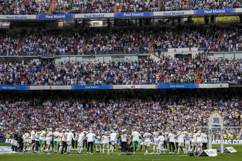 Real Madrid celebrate La Liga title after a Spanish La Liga soccer match between Real Madrid and Espanyol at the Santiago Bernabeu stadium in Madrid, Saturday, April 30, 2022. (AP Photo/Bernat Armangue)