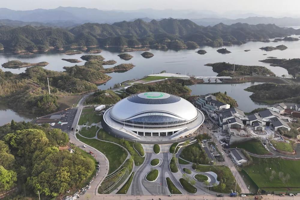 In this photo released by Xinhua News Agency, an aerial photo taken on March 28, 2022, shows a view of Chun'an Jieshou Sports Centre Velodrome, a venue of the 19th Asian Games Hangzhou 2022 in Hangzhou, eastern China's Zhejiang Province. Less than three months after Beijing hosted the Winter Olympics and Paralympics, the Olympic Council of Asia said Friday that this year's Asian Games in China are being postponed because of concerns about the spreading omicron variant of COVID-19 in the country.(Zhou Hengzhong/Xinhua via AP)