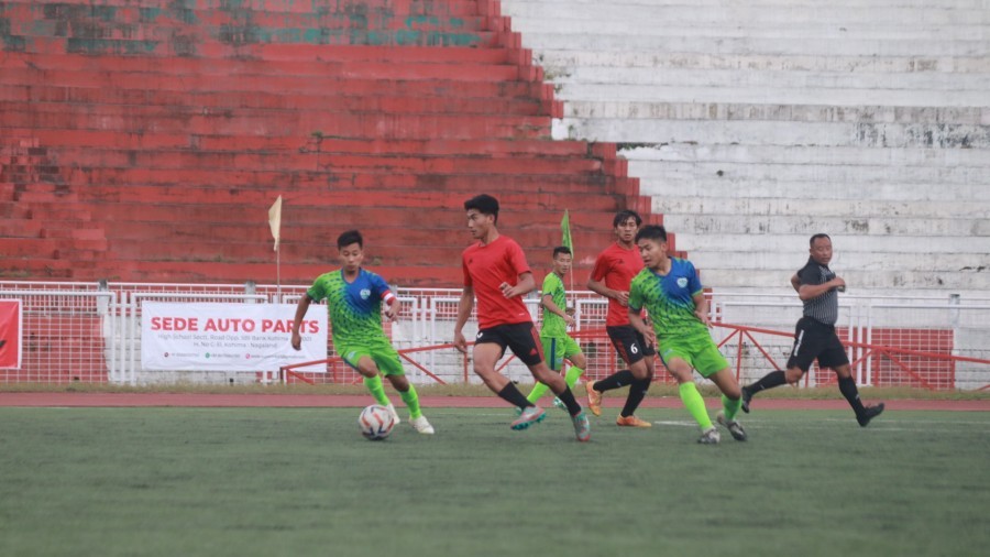 Players of New Market FC (green) and Highlander FC (red) in action during the first match of the day at IG Stadium Kohima on May 18.