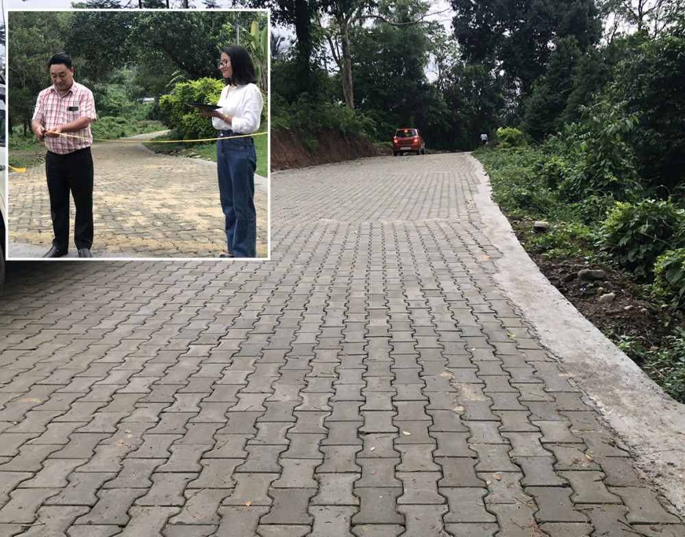 The Principal of Patkai Christian College (Autonomous), Dr Thepfuvilie Pieru inaugurates a portion of the paved road connecting the college’s old campus with the administrative building on May 17. The road, covering nearly half a kilometre, was constructed by the Alumni Association PCC (AAPCC) as a part of its second phase of the campus road project. In 2017, the Association started the project to repair the dilapidated road inside the campus and the first phase covered 260 metres. The road project is funded by contributions from various quarters, including faculty & staff, students, alumni and well-wishers as well as proceeds from the cafeteria being operated by the AAPCC. According to the AAPCC, the third phase would begin when all accounts for the 2nd phase are settled, and further requested support for the road project from alumni and others to complete the whole stretch. (Morung Photo)