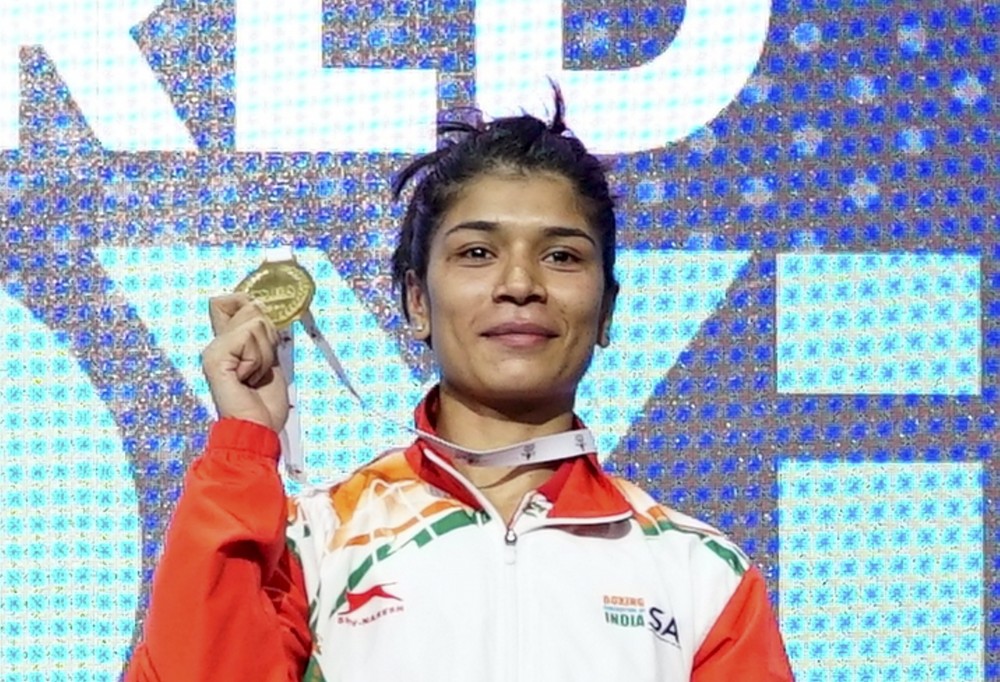 ndian boxer Nikhat Zareen poses with her gold medal after winning Women's World Championship match against Thailand's Jitpong Jutamas in the flyweight (52kg) final, in Istanbul on Thursday, May 19, 2022. (PTI Photo)