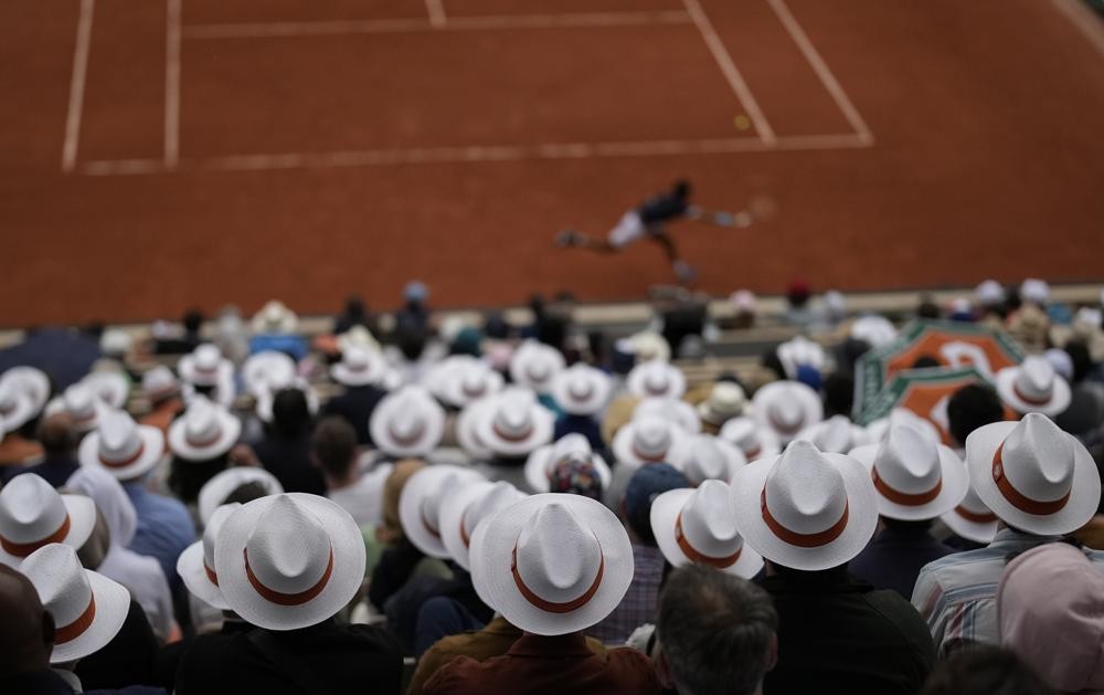 Spectators watch first round matches at the French Open tennis tournament in Roland Garros stadium in Paris, France, Sunday, May 22, 2022. (AP Photo/Christophe Ena)