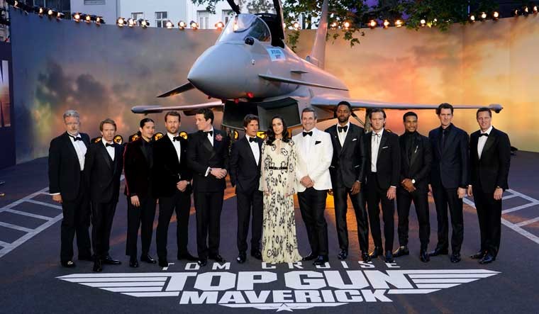 From left, producer Christopher McQuarrie, producer Jerry Bruckheimer, Danny Ramirez, Glen Powell, Miles Teller, Tom Cruise, Jennifer Connolly, Jon Hamm, Jay Ellis, Lewis Pullman, Greg Tarzan Davis, director Joseph Kosinski and producer David Ellison pose for the media during the 'Top Gun Maverick' UK premiere at a central London cinema | AP