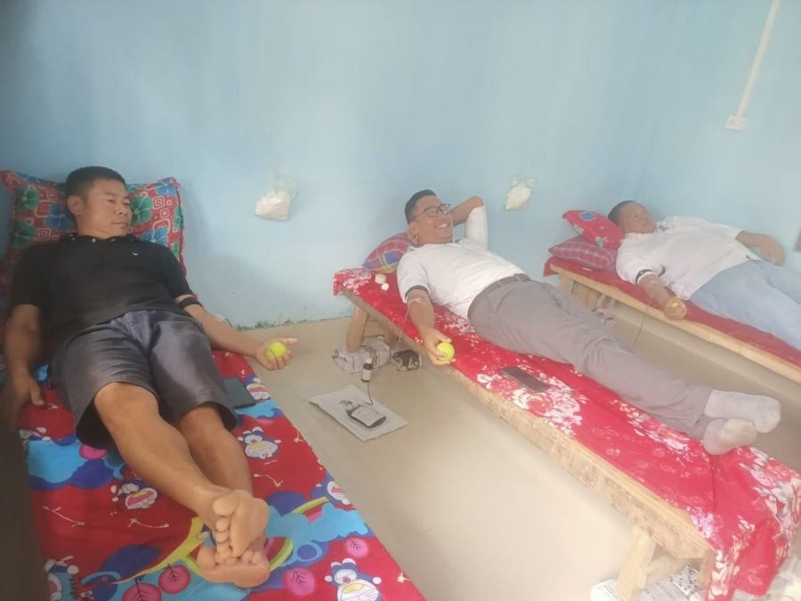 Volunteers donate blood during the camp held in Sovima village on June 29.