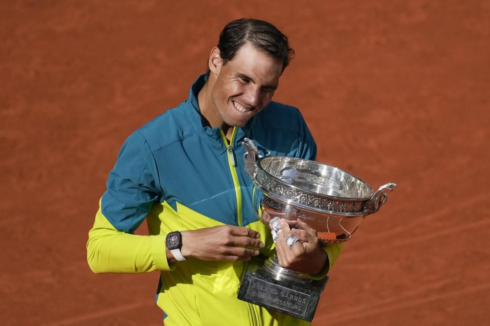 Spain's Rafael Nadal holds the trophy after winning the final match against Norway's Casper Ruud in three sets, 6-3, 6-3, 6-0, at the French Open tennis tournament in Roland Garros stadium in Paris, France, Sunday, June 5, 2022. (AP Photo/Christophe Ena)