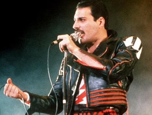 In this 1985 file photo, singer Freddie Mercury of the rock group Queen, performs at a concert in Sydney, Australia. (File | AP)