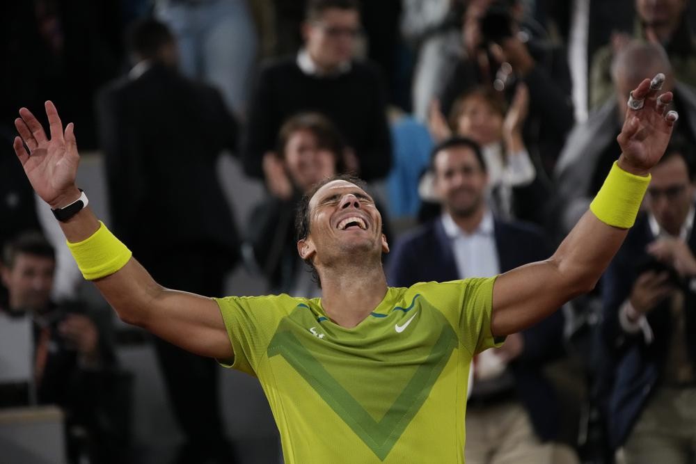 Spain's Rafael Nadal celebrates winning his quarterfinal match against Serbia's Novak Djokovic in four sets, 6-2, 4-6, 6-2, 7-6 (7-4), at the French Open tennis tournament in Roland Garros stadium in Paris, France, Wednesday, June 1, 2022. (AP Photo/Christophe Ena)