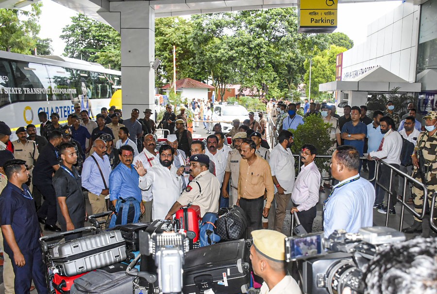 Rebel Shiv Sena leader Eknath Shinde with supporting MLAs arrives at Guwahati International Airport, Wednesday, June 29, 2022. After delaying their departure by around two hours, the dissident MLAs decided to leave for Goa, from where they will go to Mumbai for the floor test on Thursday. (PTI Photo)