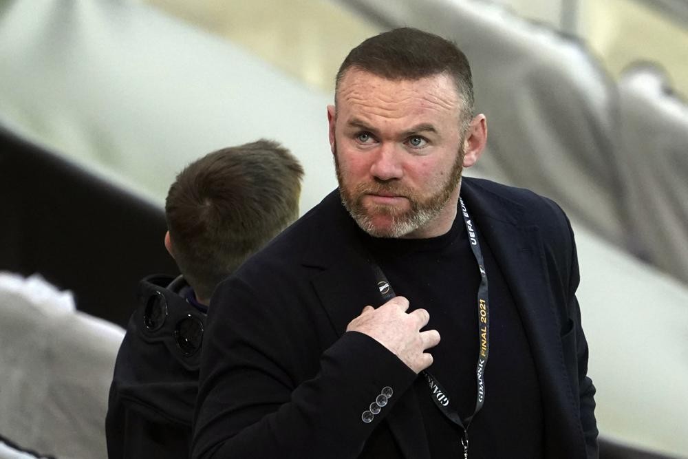FILE - Former Manchester United player Wayne Rooney attends the Europa League final soccer match between Manchester United and Villarreal in Gdansk, Poland on May 26, 2021. Rooney has agreed to be D.C. United’s next coach, a person with knowledge of the move said. The person spoke to The Associated Press on condition of anonymity Sunday, July 10, 2022, because the deal had not been announced. (Aleksandra Szmigiel/Pool Photo via AP, File)