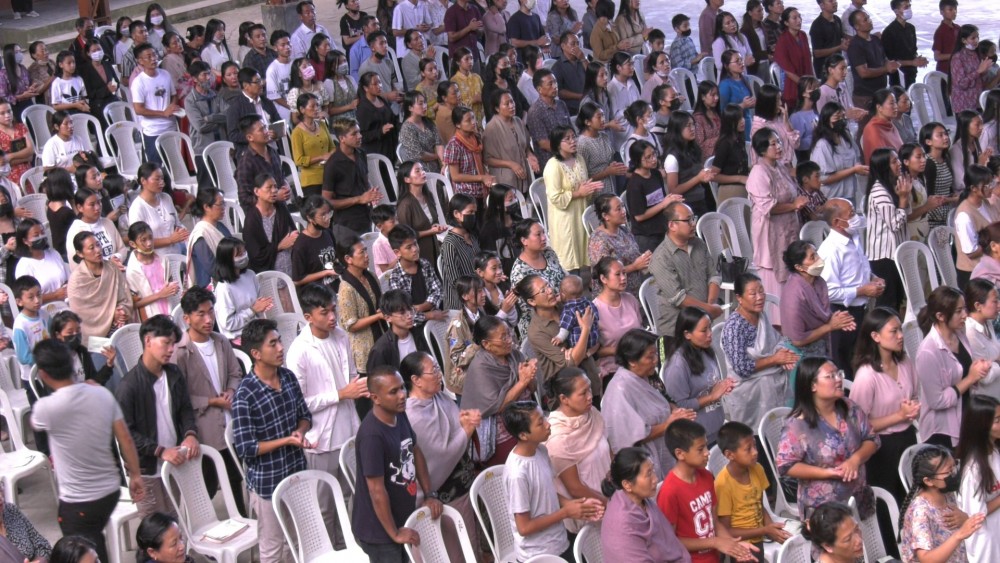 Section of congregation at Mezhür Higher Secondary School, Midlane colony.