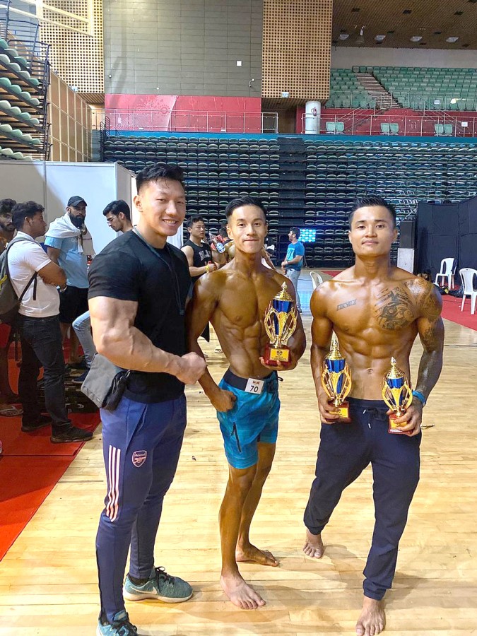 Toshi Akum and Athrong Zeliang with Keneilelie Sorünuo.