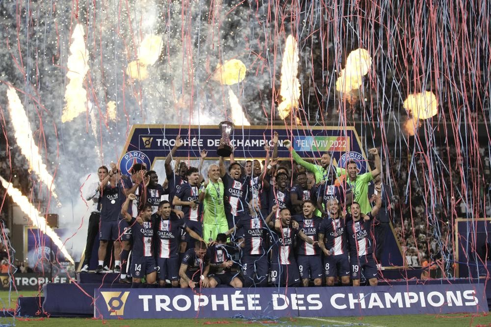 PSG's Marquinhos holds the trophy after winning the French Super Cup final soccer match between Nantes and Paris Saint-Germain at Bloomfield Stadium in Tel Aviv, Israel, Sunday, July 31, 2022. PSG won 4-0. (AP Photo/Ariel Schalit)