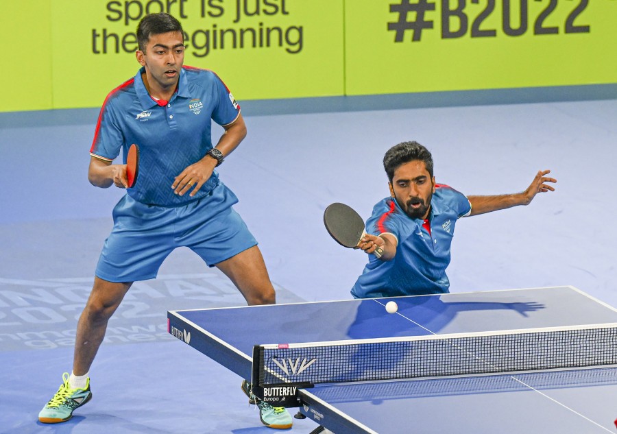India’s Harmeet Desai and Sathiyan Gnanasekaran play against Singapore’s Izaac Quek Yong and Pang Yew En Koen during the final of the Table Tennis Men’s team event at the Commonwealth Games 2022 (CWG), in Birmingham on August 2. (PTI Photo)