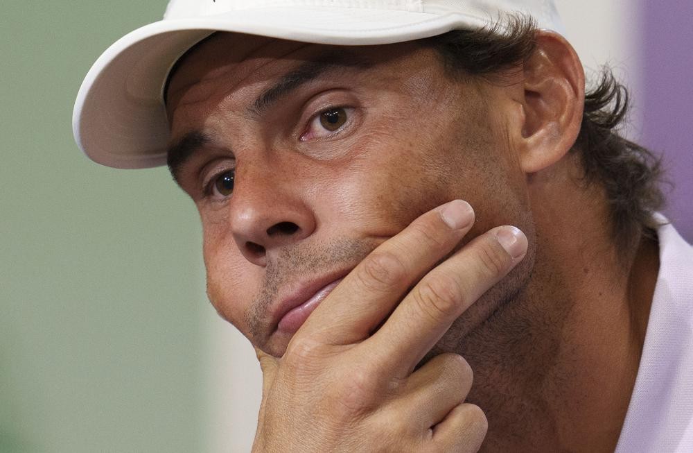 FILE - Spain's Rafael Nadal announces that he is withdrawing from the semi-final of the Gentlemen's Singles during a press conference at The All England Lawn Tennis Club, Wimbledon, Thursday, July 7, 2022. Nadal has withdrawn from the upcoming hard-court tournament in Montreal because of the abdominal injury that caused him to pull out of Wimbledon ahead of the semifinals. The Spaniard had been 19-0 in Grand Slam matches this year when he decided the injury was too much at Wimbledon. (Joe Toth/Pool Photo via AP, File)