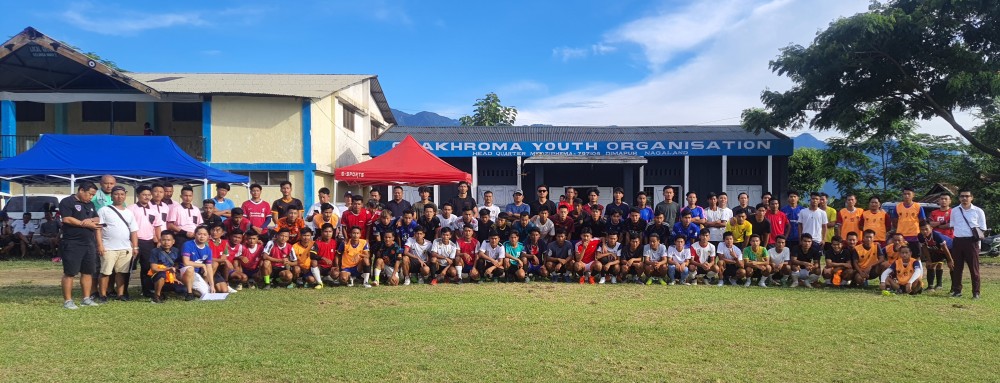Aspiring footballers with CDFA officials and others during selection trial on August 6.