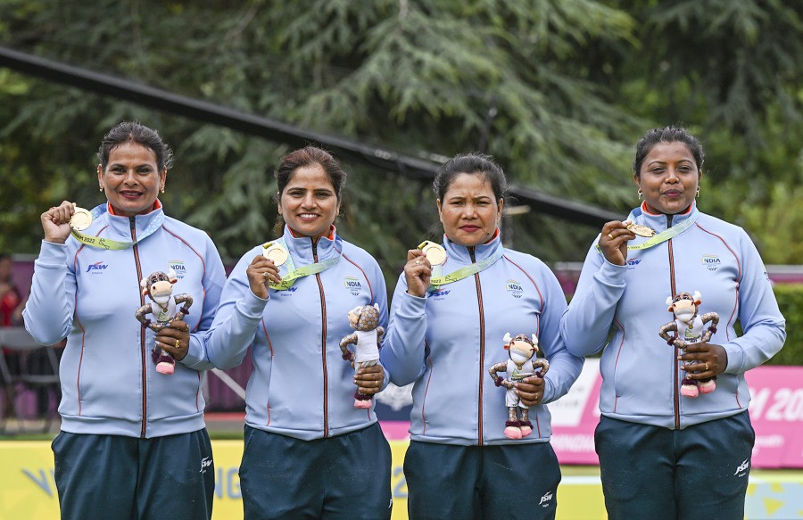 India's Lovely Choubey, Pinki, Nayanmoni Saikia and Rupa Rani Tirkey pose for photos during a presentation ceremony after winning the Lawn Bowls Women's Fours final match against South Africa, at the Commonwealth Games 2022 (CWG), in Birmingham on August 2. (PTI Photo)