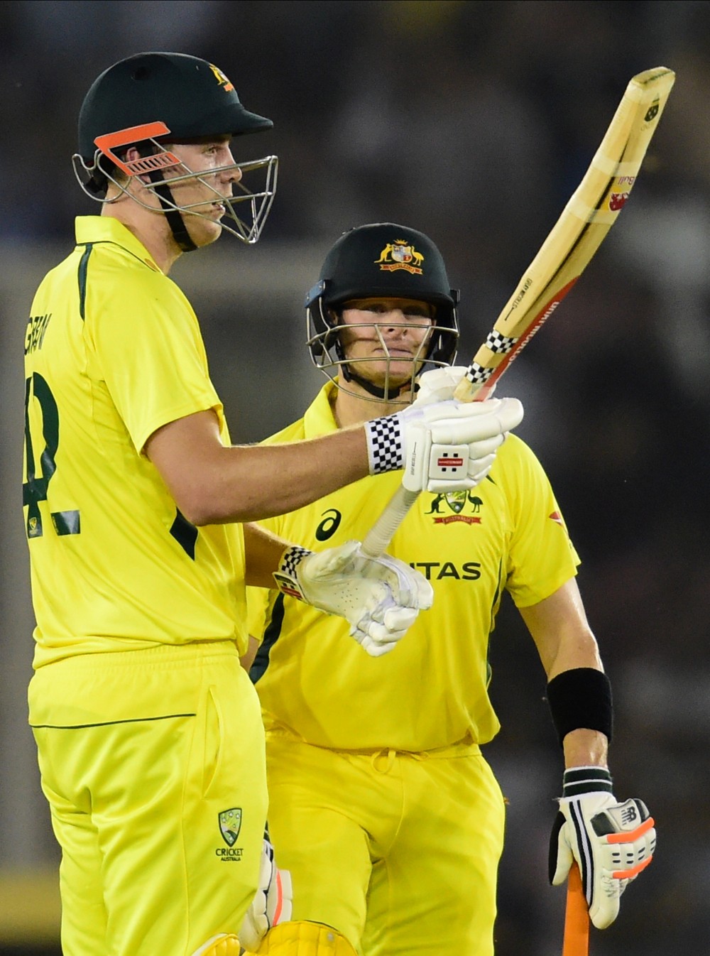 Australian batsman Cameron Green celebrates his half century during the 1st T20 cricket match between India and Australia, at IS Bindra PCA Stadium in Mohali, Tuesday, Sept. 20, 2022. (PTI Photo/Kamal Kishore)