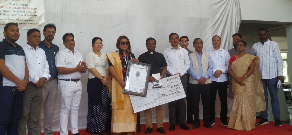 Prof Rosemary Dzüvichu being conferred the Peace Award 2022 by members of Peace Channel at their centre in 7th Mile Chümoukedima on September 21 (Morung Photo). 
