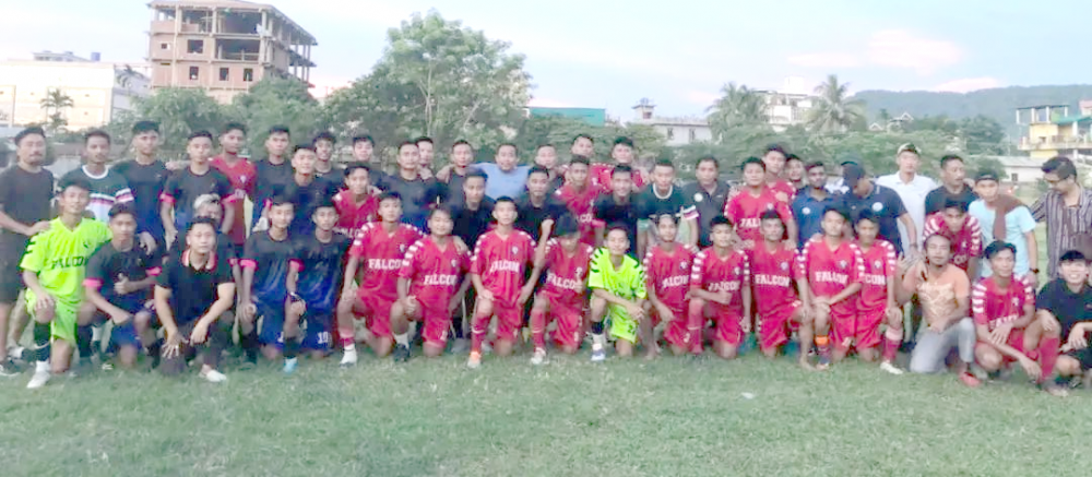 Players of United Falcon Club (Red) and Chümoukedima FC (blue) before the match on September 21.