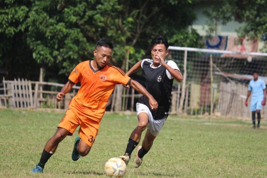 Match in action between Puiteing FC (Orange) and LekieMtei FC (Black). (PDFA)