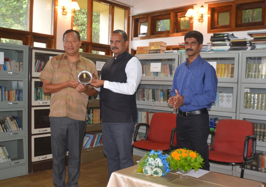 Commissioner & Secretary to Governor, T Mhabemo Yanthan presenting a memento to the retiring Additional Secretary to Governor, George Abraham in a farewell programme held at Raj Bhavan Kohima on September 30. (Photo Courtesy: PRO Raj Bhavan)