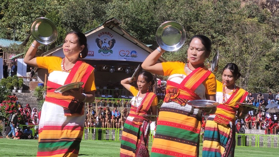 The Dimasa Kachari Cultural Troupe today performed Bai Maijai (Folk Dance) on Day 5 of Cultural Connect at the ongoing Hornbill Festival 2022 at Kisama. In olden times, upon receiving news of victory, the women folk of the village went out half way to receive their victorious warriors. With rock in their hands, portraying the invincibility of their home coming heroes, the women folk danced jubilantly in celebration of this momentous event. The warriors responded by enacting the swift movement of the praying mantis and the graceful soar of the mighty eagle. (Morung Photo)